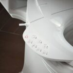 Kohler PureWash E750 Elongated Bidet Seat with Touchscreen Remote Control with Two Programmable User Presets, Continuously Heated Water, Front and Rear Wash Modes, Adjustable Water Temperature and Pressure, Automatically UV Light Self-Cleaning Stainless Steel Wand, Heated Seat, Warm-air Drying System, Carbon Filter, and LED Nightlight Technology White